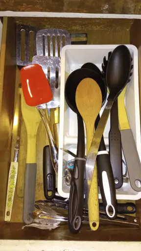 Red spoon/spatchula in a drawer separated by that criteria.